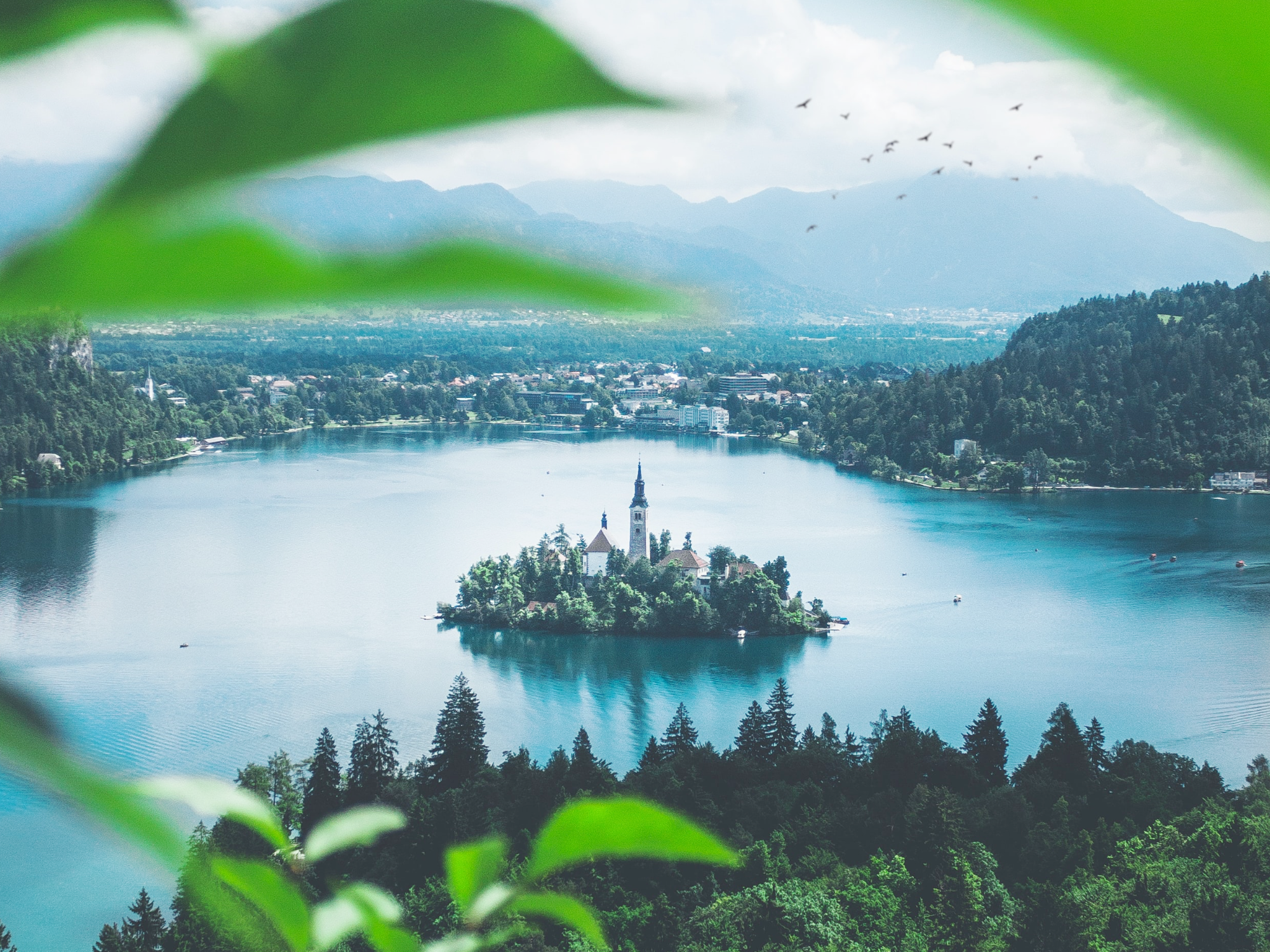 An island with a tower in the middle of Lake Bled in Slovenia