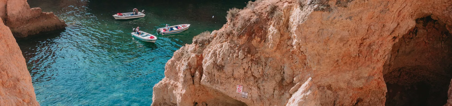 Boats floating among the rocks