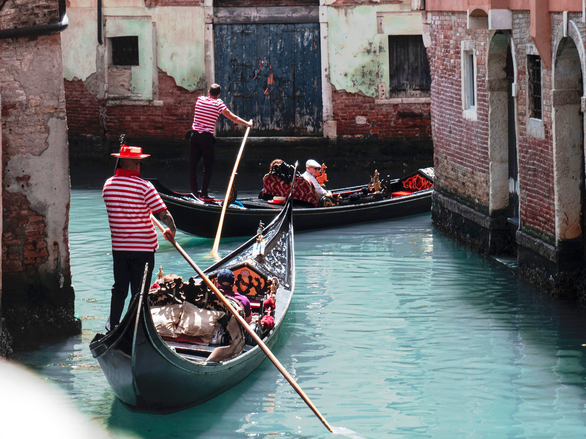 Gondolas with tourists in Venice
