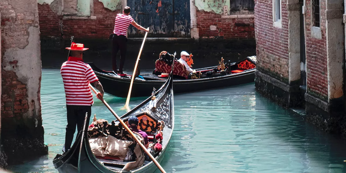 Gondolas with tourists in Venice