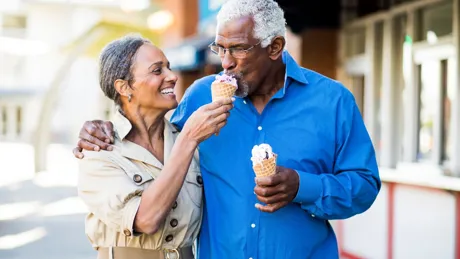 African American senior couple on the town with ice cream