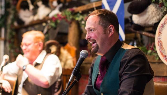 A man speaking into a microphone
