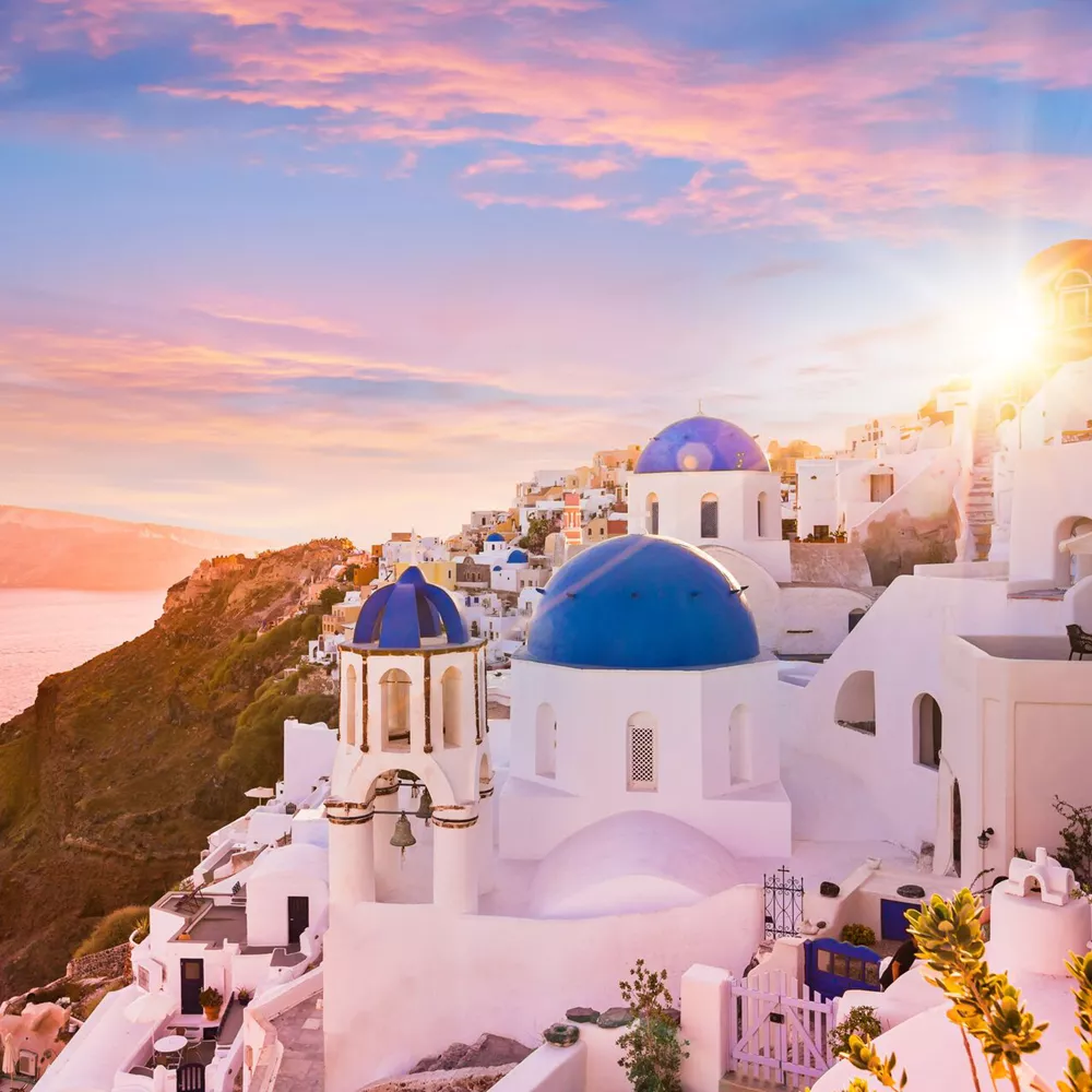Sunset View Of The Blue Dome Churches Of Santorini, Greece