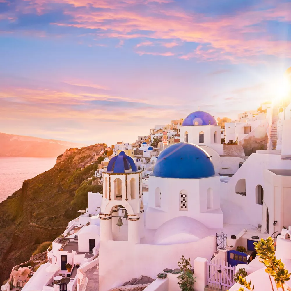 Sunset View Of The Blue Dome Churches Of Santorini, Greece 