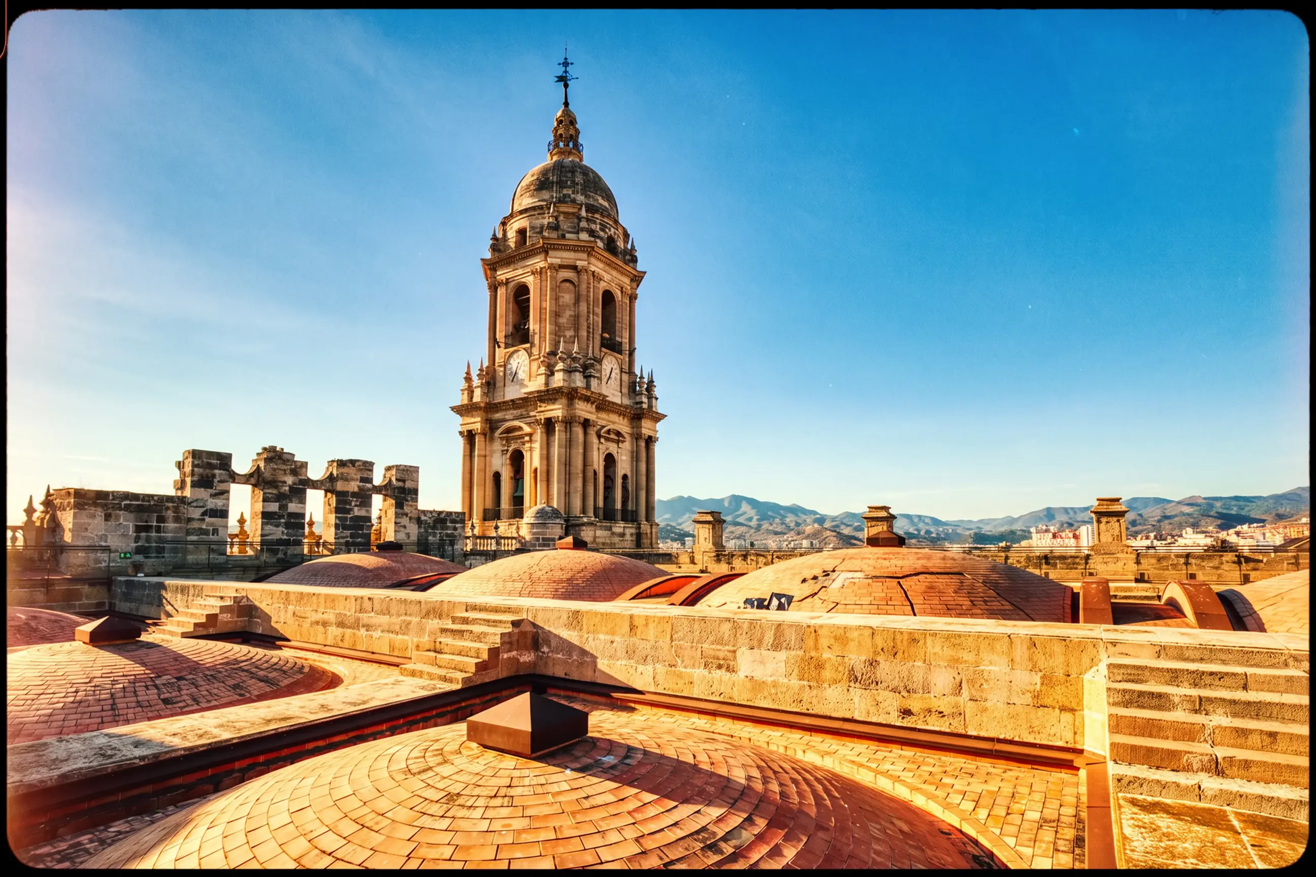 day-hero-cathedral-rooftop-at-sunset-in-malaga-spain.webp
