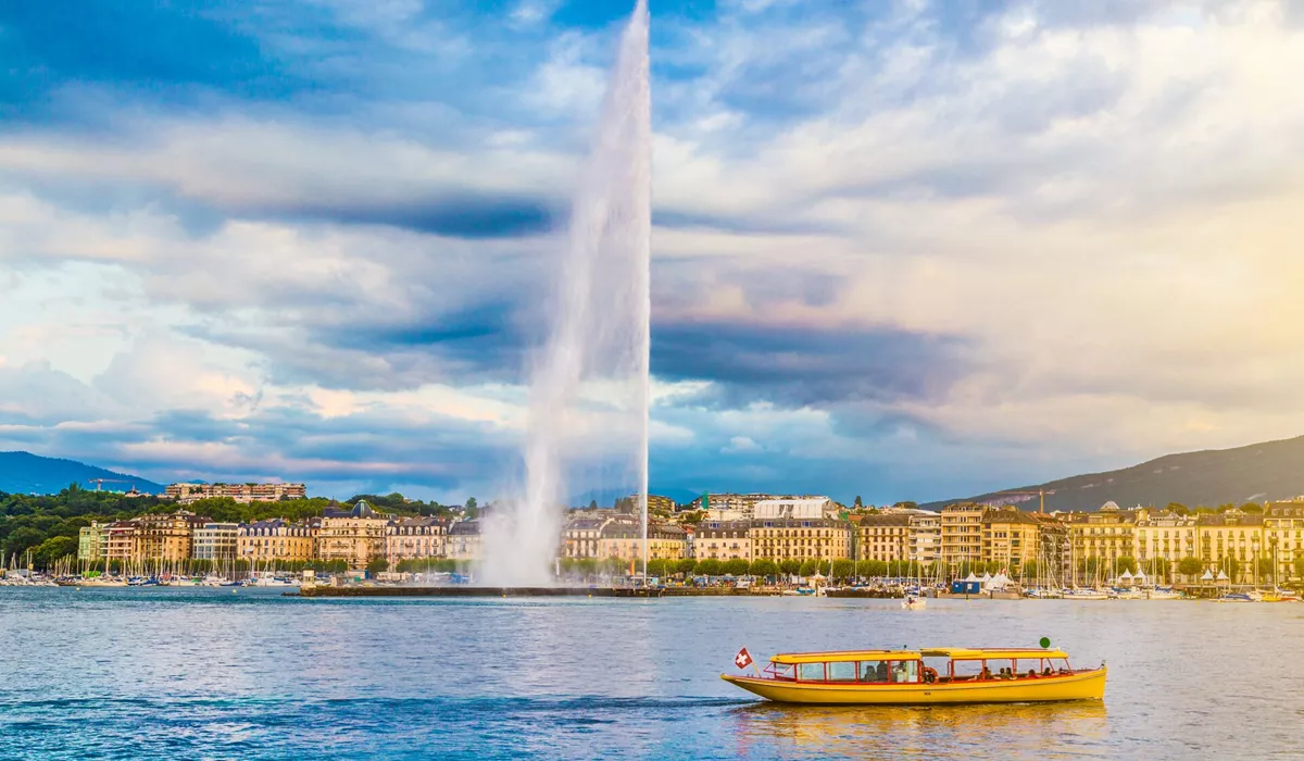 City of Geneva with Jet D Eau Fountain at sunset in Switzerland