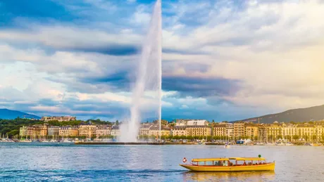 City of Geneva with Jet D Eau Fountain at sunset in Switzerland