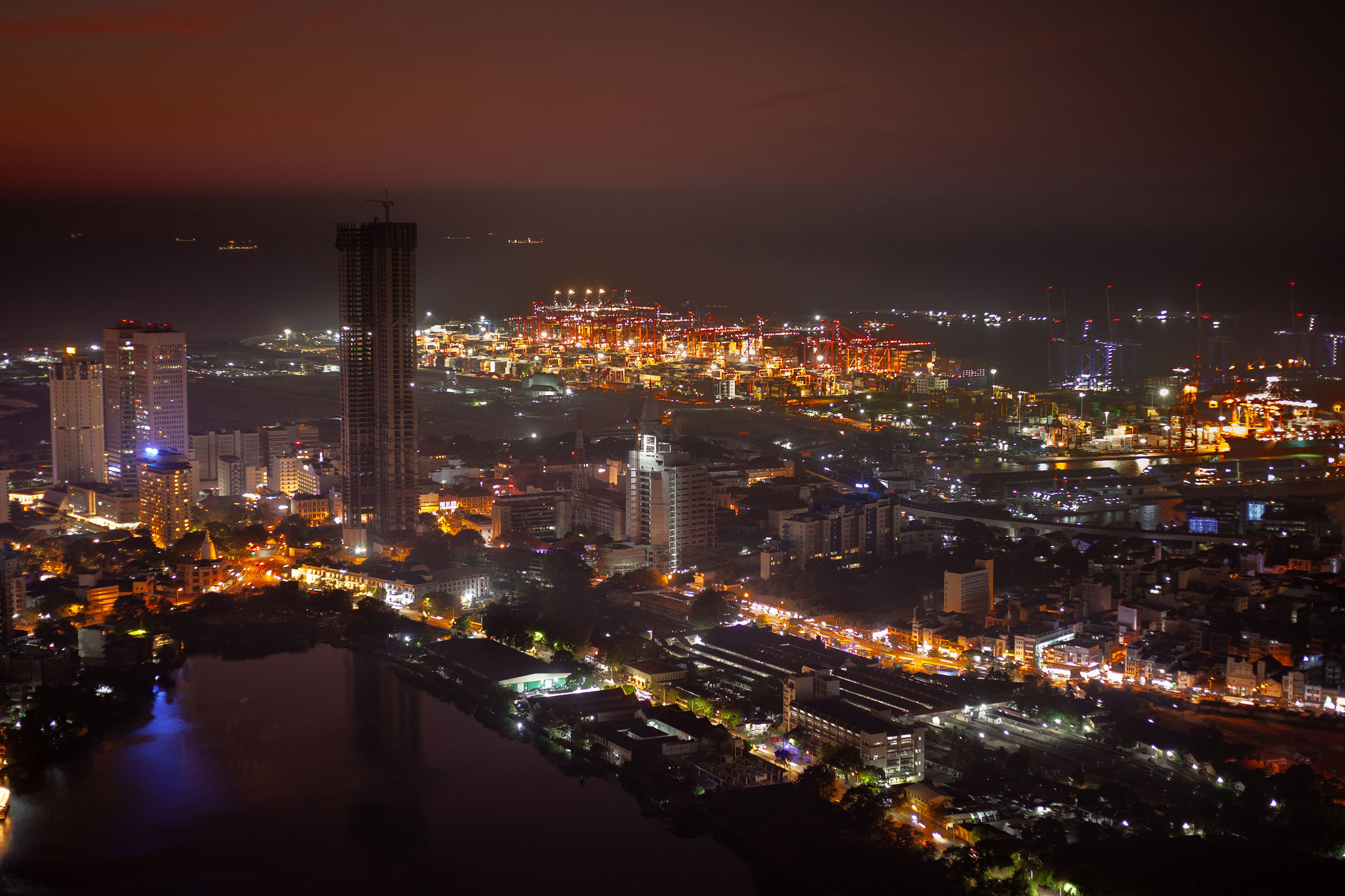 City skyline illuminated with bright lights during night view, Colombo, Sri Lanka