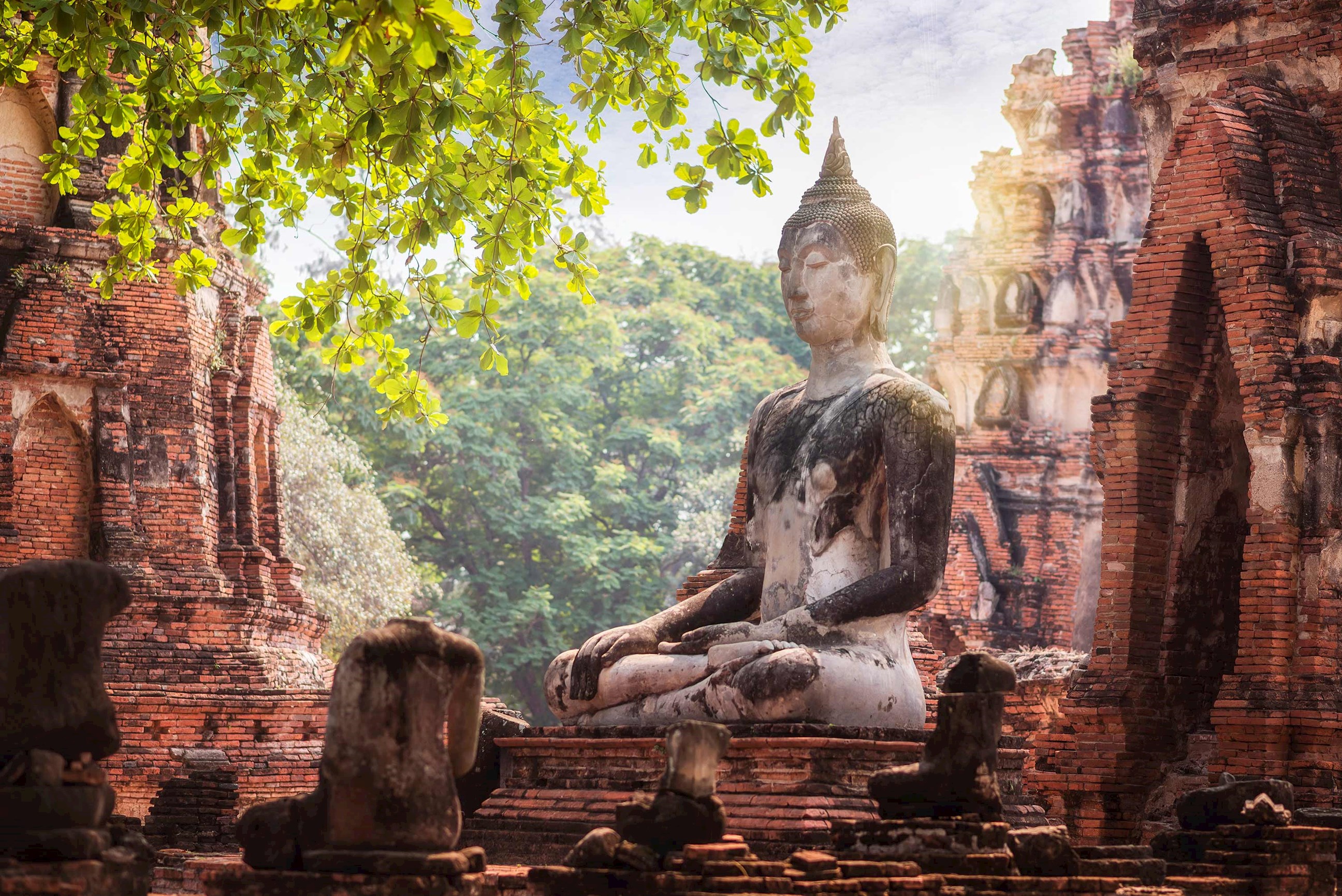 Buddha statue in subduing Mara posture at Wat Mahathat Ayutthaya, Thailand