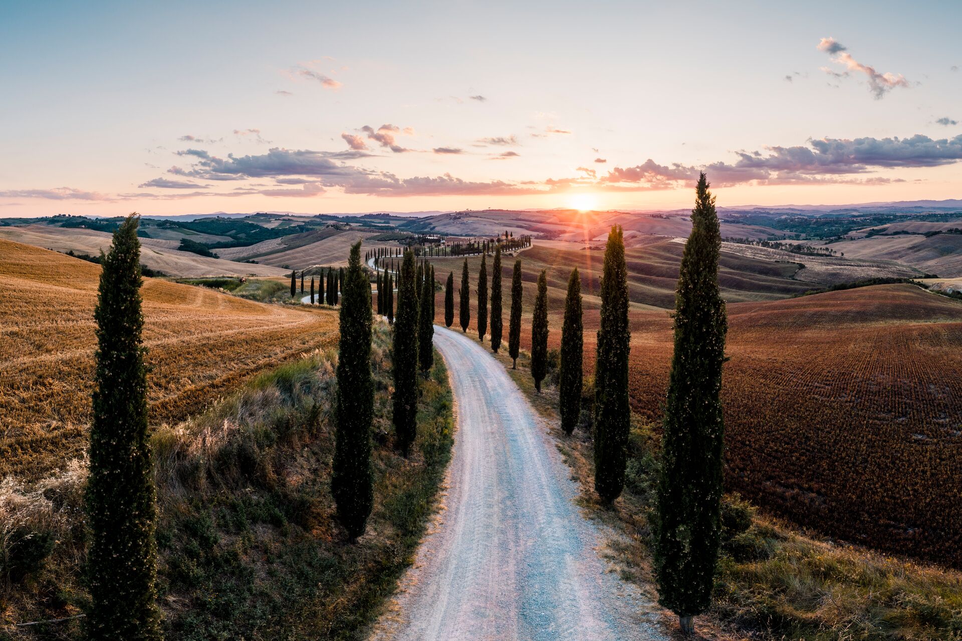 large-road-lined-with-cypresses-tuscany-italy-1257551854.jpg