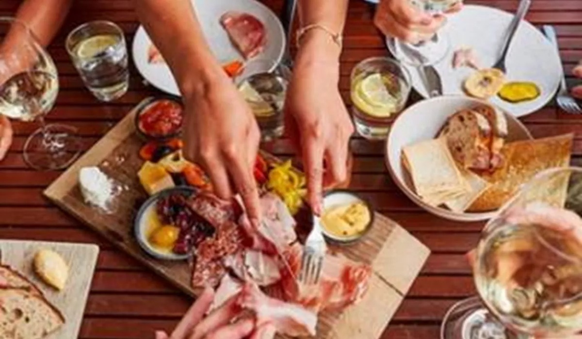 Guests feasting on wine and charcuterie boards