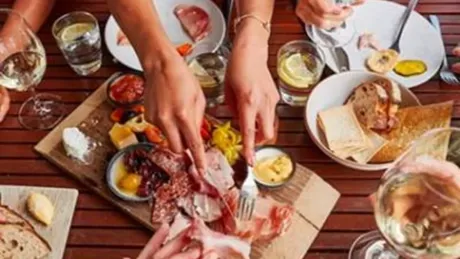 Guests feasting on wine and charcuterie boards