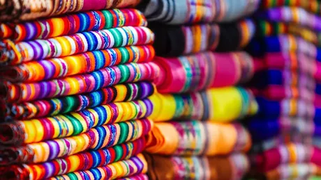 Macro Close Up Of Colorful Blankets Stacked With Andean Designs