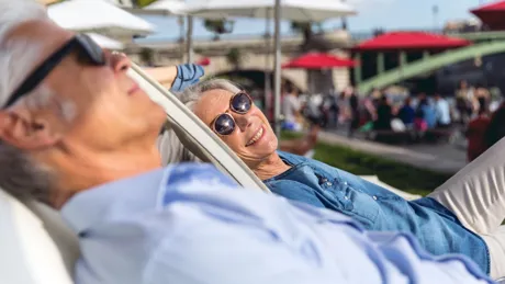 Seniors taking a break in Paris, relaxing on The Seine River, France