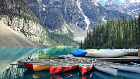Colorful boats on Lake Moraine in Canada