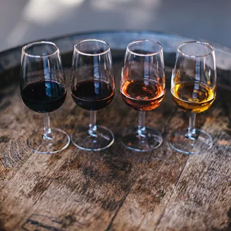 A selection of port on a barrel during port tasting