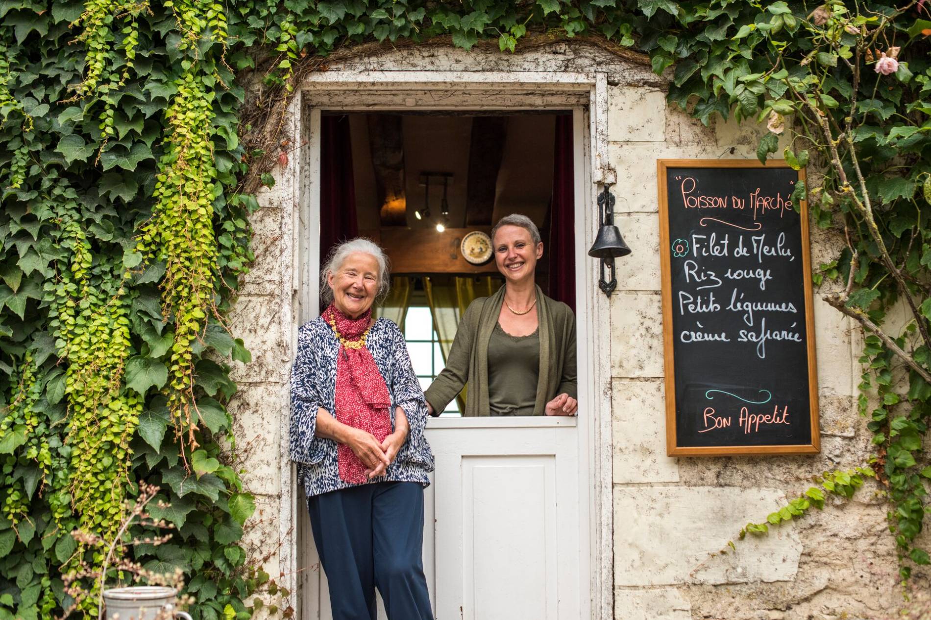 Alexandra and Beatrice Montferrier standing at the entrance to Domaine de la Giraudiere in France