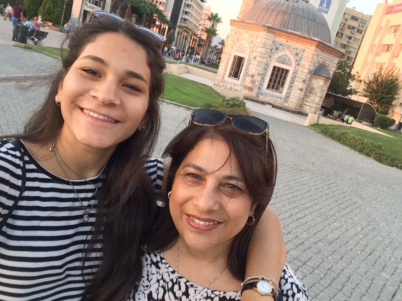 Mother and daughter In Front Of Konak Mosque in Turkey