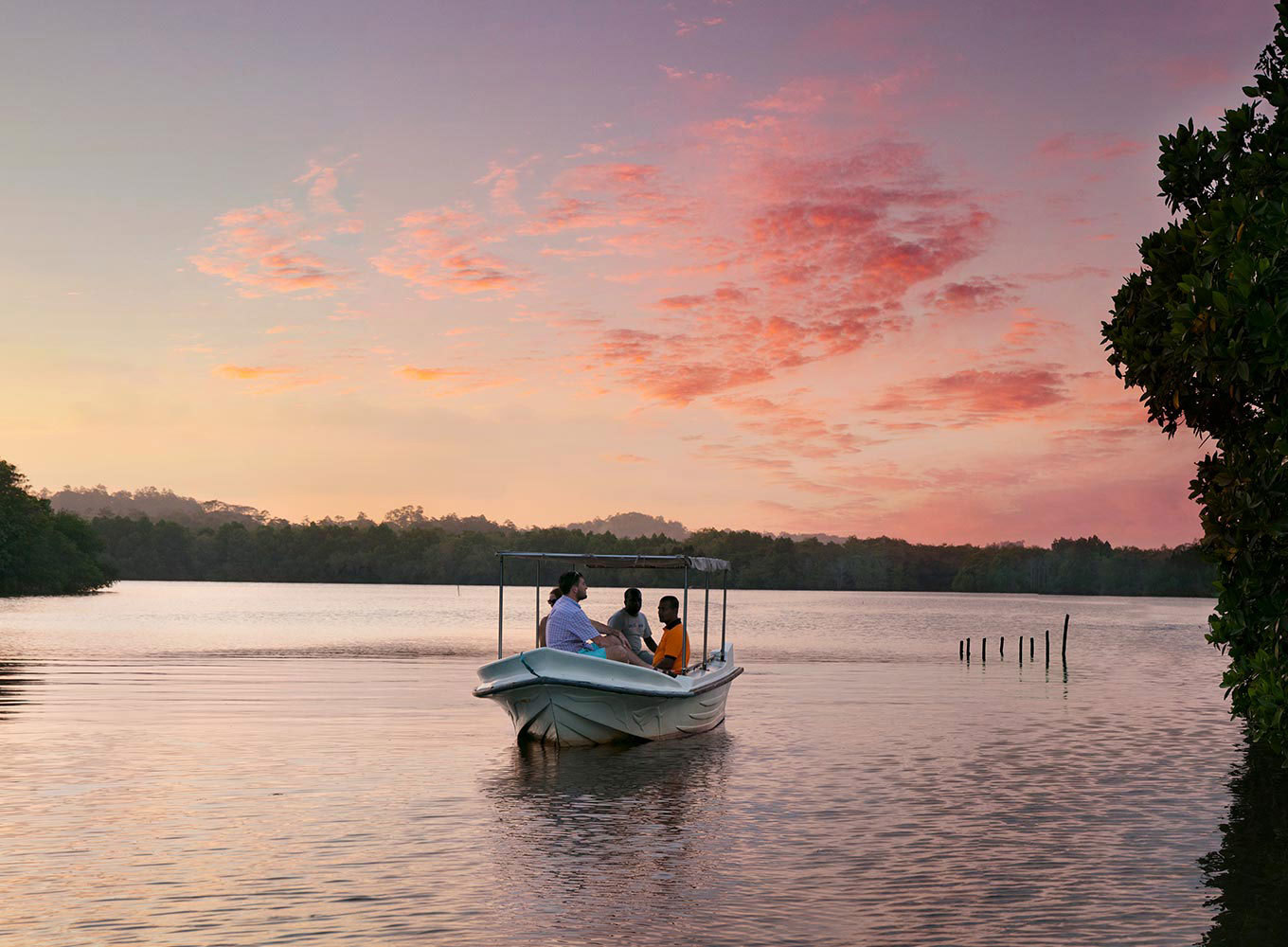 Small boat floating on calm water during sunset, Galle, Sri Lanka
