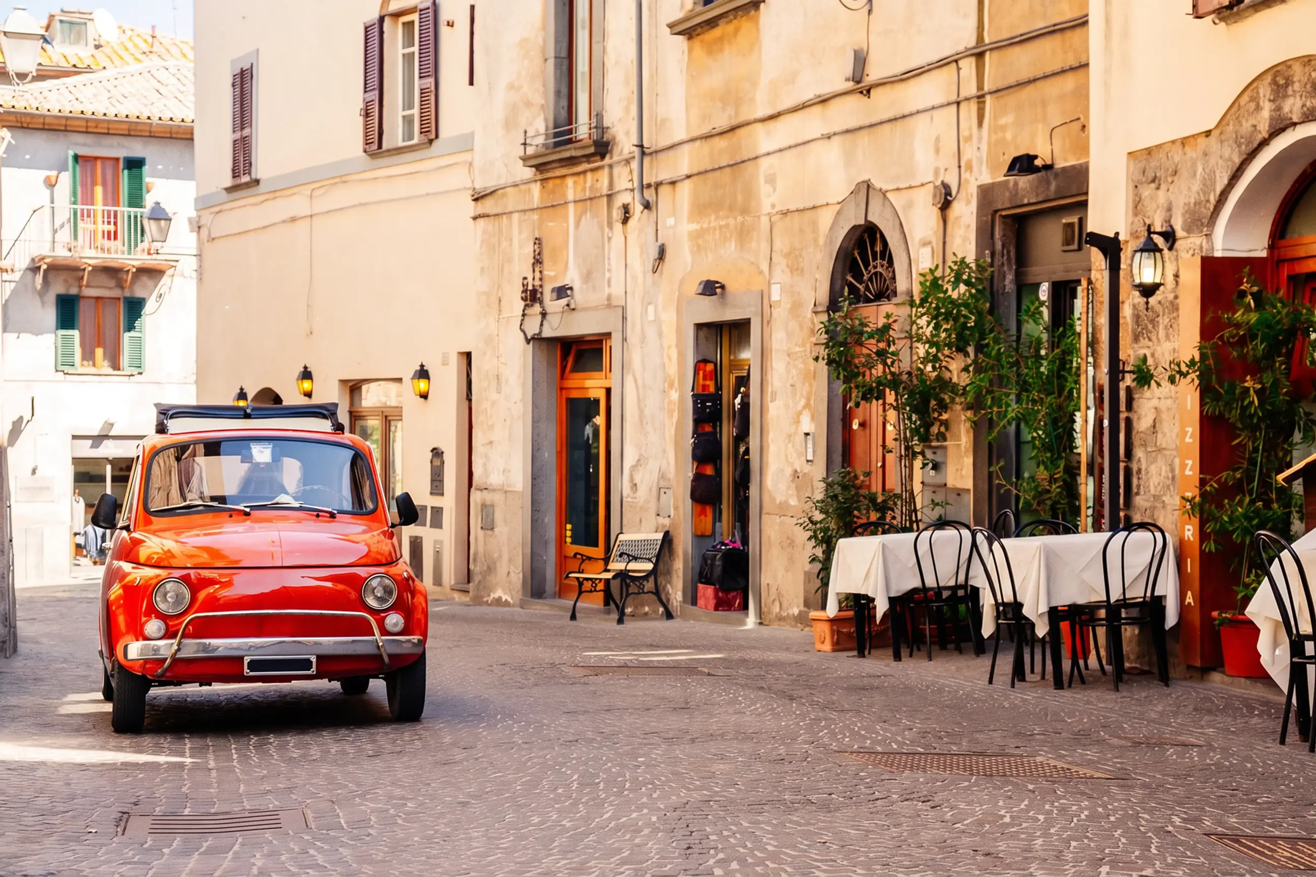 day-hero-old-red-small-vintage-car-rome-italy.webp