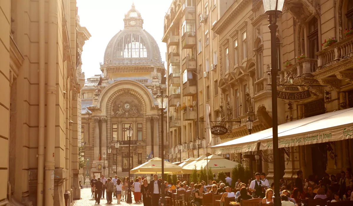 A group of people walking down a street in Bucharest