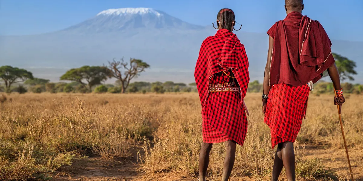 Warriors From Maasai Tribe Looking At Mount Kilimanjaro, Kenya, Africa