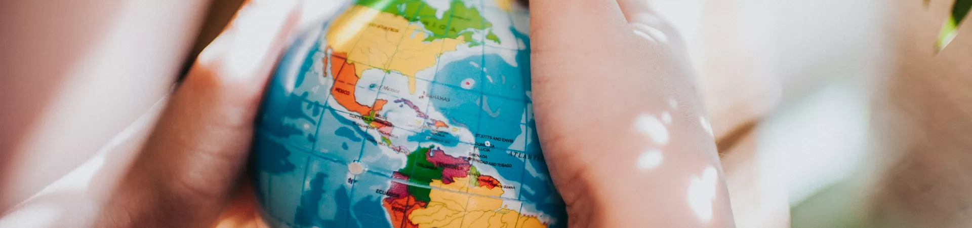 A person holding the globe