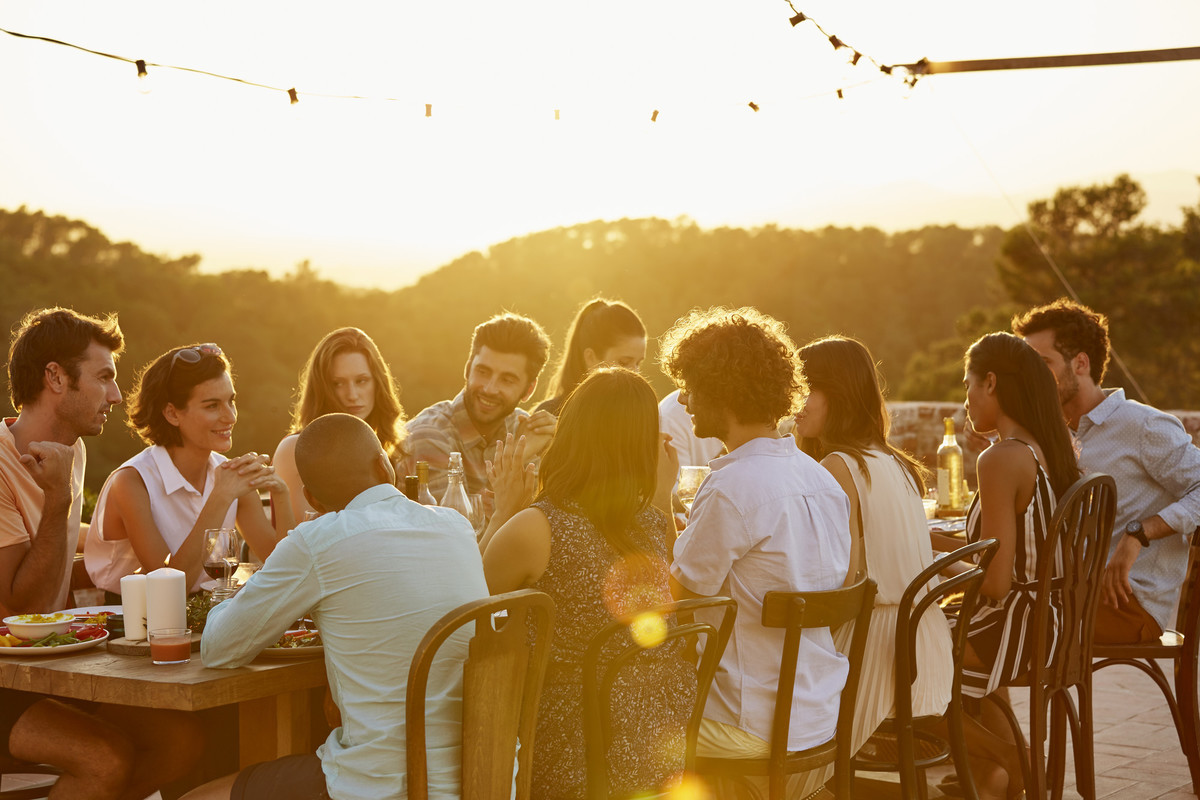 Group of travellers dining outside