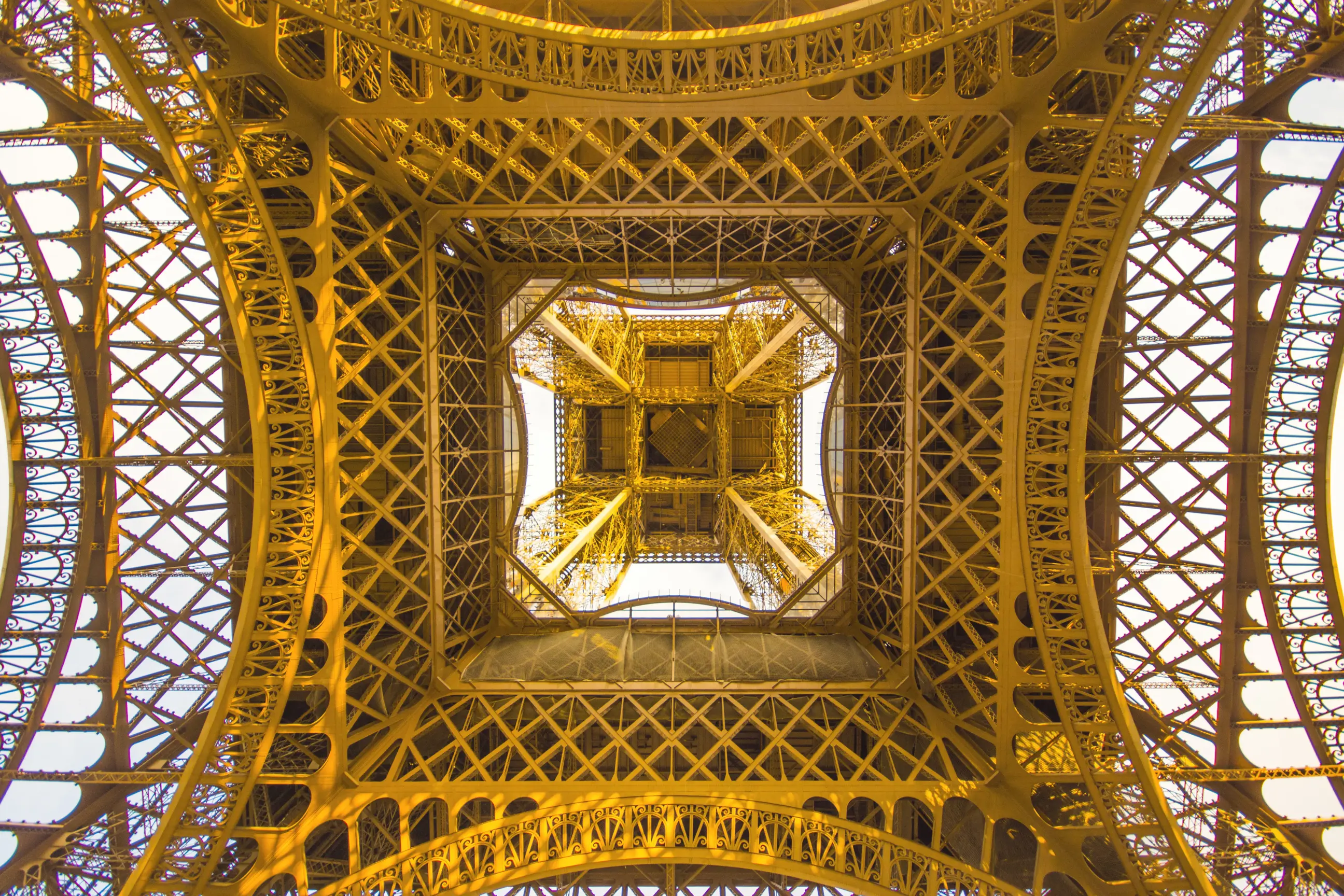 day-hero-looking-up-at-eiffel-tower-paris-france.webp
