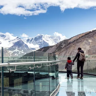 Mother and son walking on Columbia Icefield Skywalk in Jasper National Park, Canada