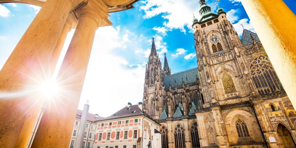 Low-angle shot of St Vitus Cathedral in Prague, early in the morning with the sun shining