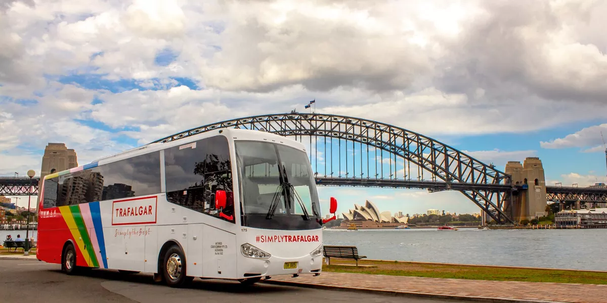 A Trafalgar coach in front of the Sydney Harbour Bridge in Sydney, Australia