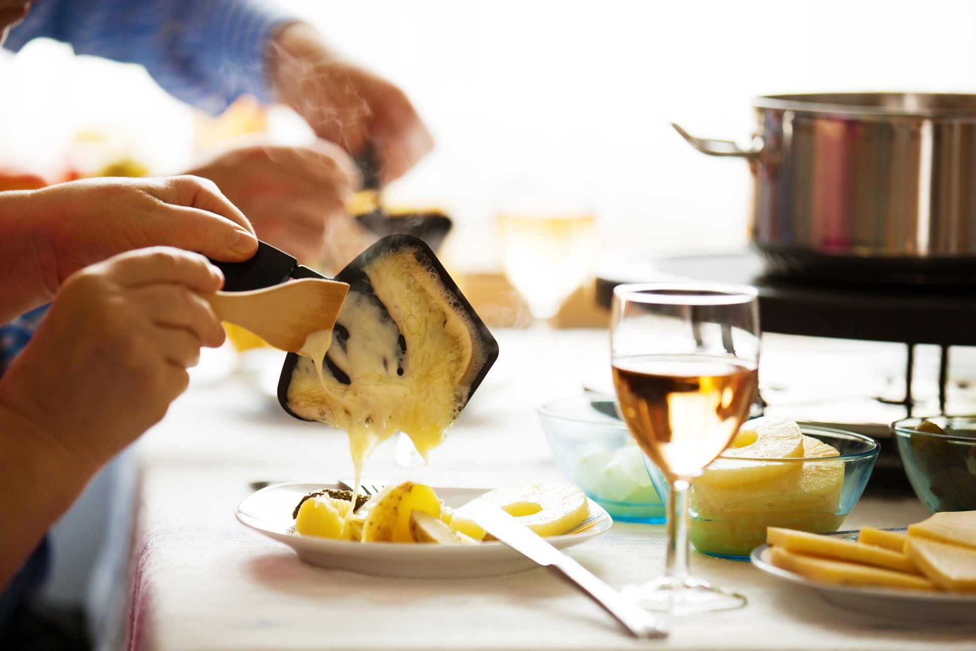 Family Eating Raclette Close Up Concept