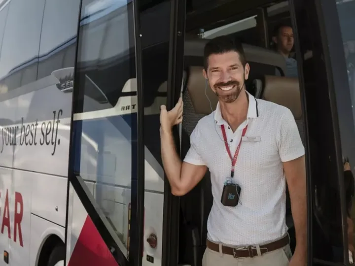 Travel guide in Trafalgar bus