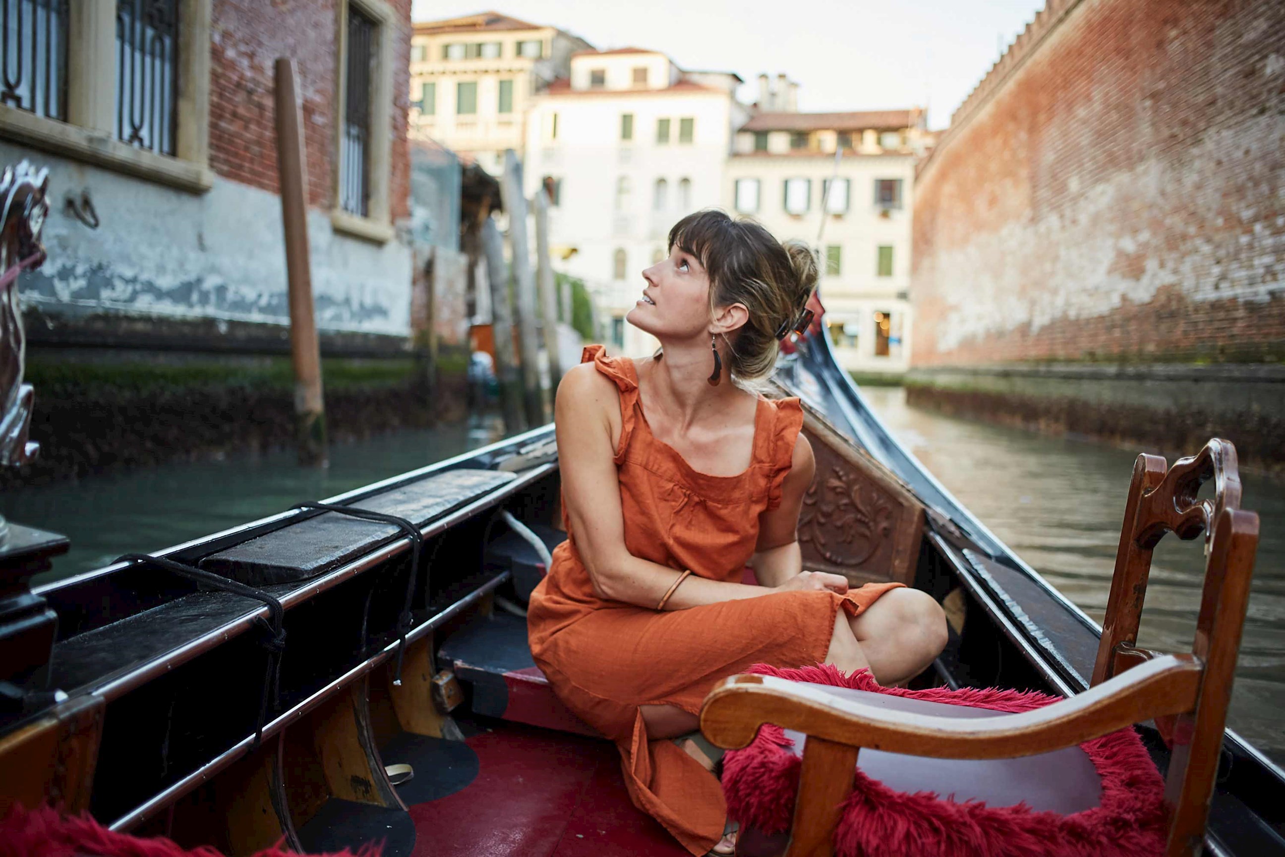 A person on a boat in the Grand Canal in Venice, Italy
