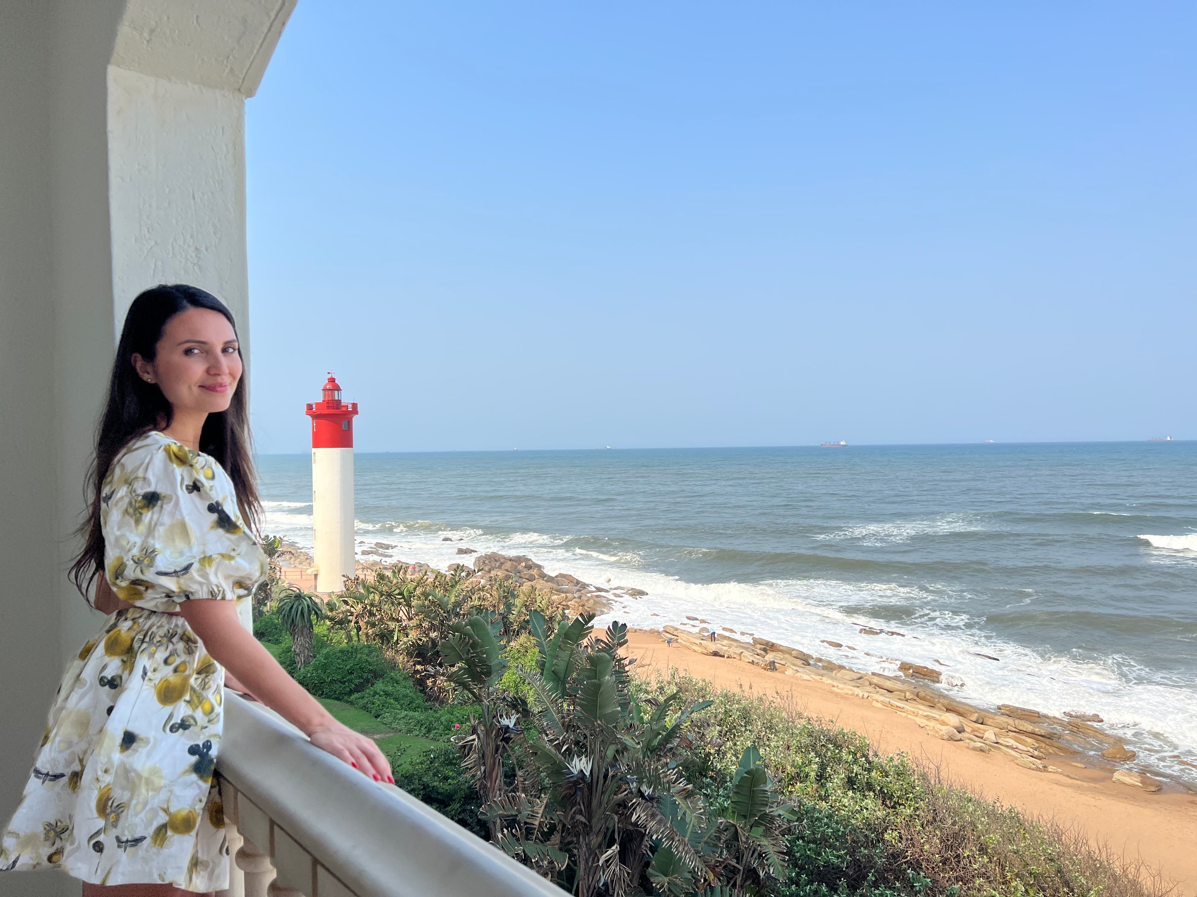 Trafalgar guest Vanesssa in front of the ocean in South Africa