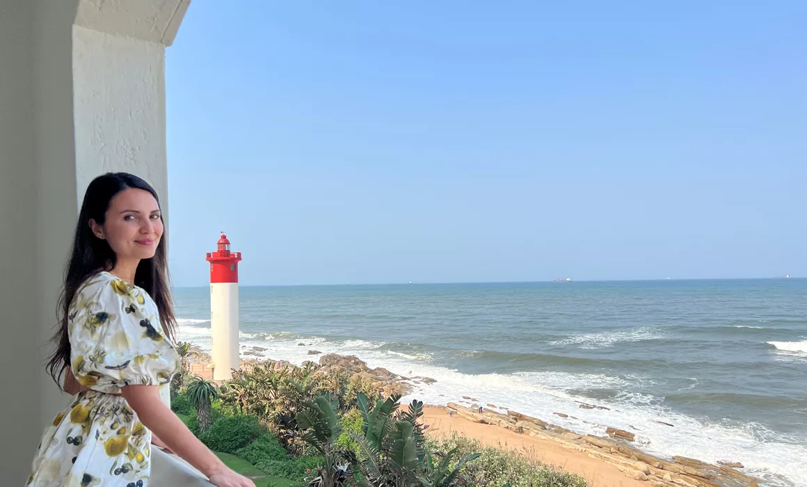 Trafalgar guest Vanesssa in front of the ocean in South Africa
