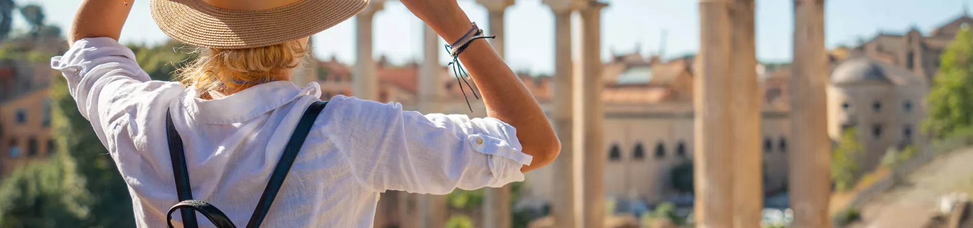 Woman looking at the Forum while on holiday in Rome, Italy