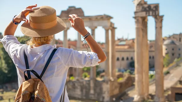 Woman looking at the Forum while on holiday in Rome, Italy