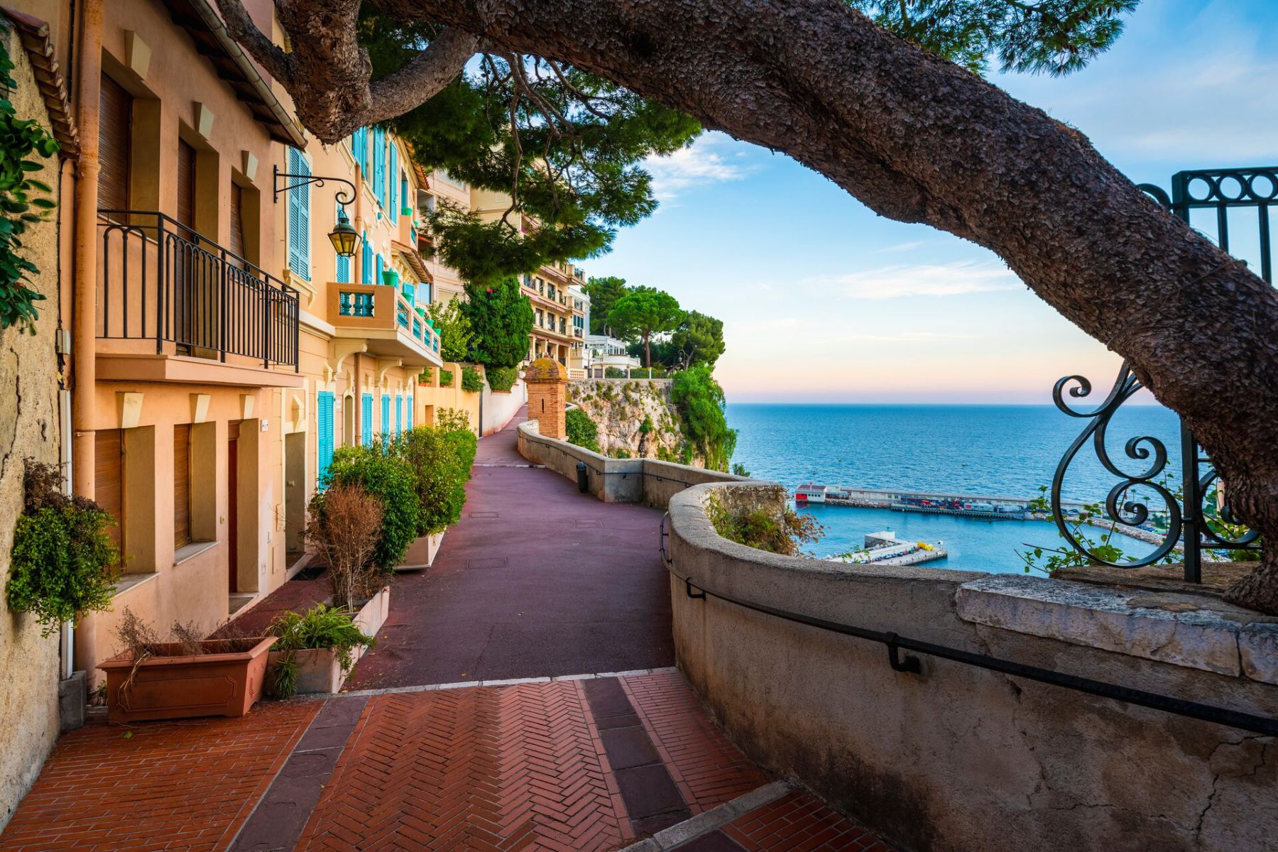 Row of houses by the seaside alley in Port De Fontvieille, Monaco