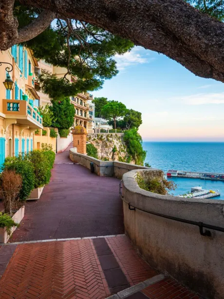 Row of houses by the seaside alley in Port De Fontvieille, Monaco