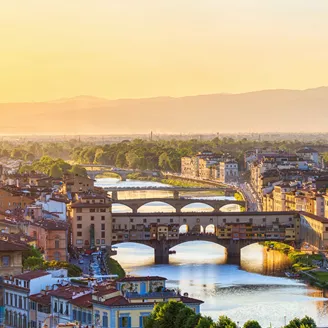 View Of Florence At Sunset With The Ponte Vecchio Bridge And The Arno River