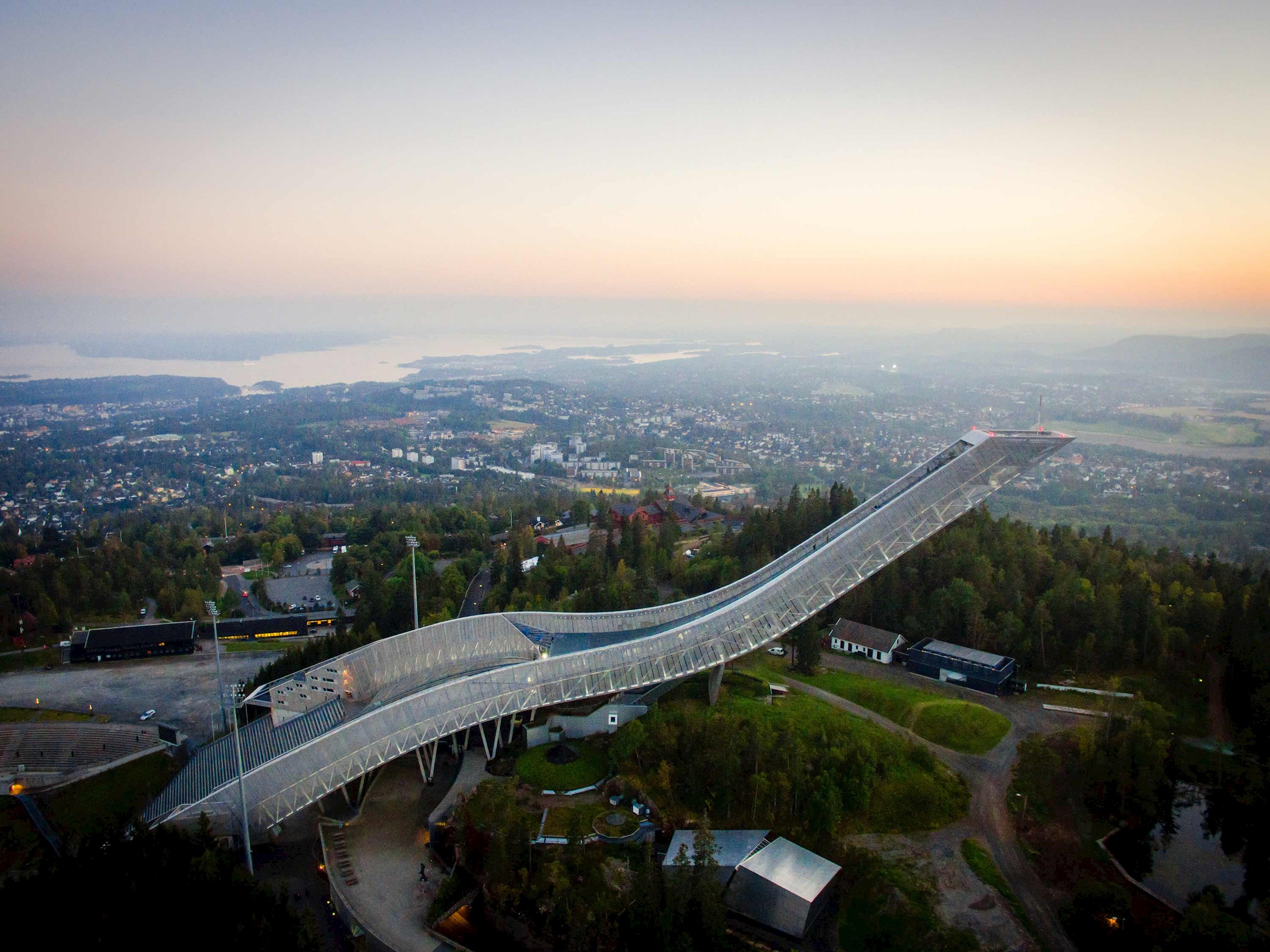 Holmenkollen Ski Jump in Oslo overlooking city and fjord at sunset