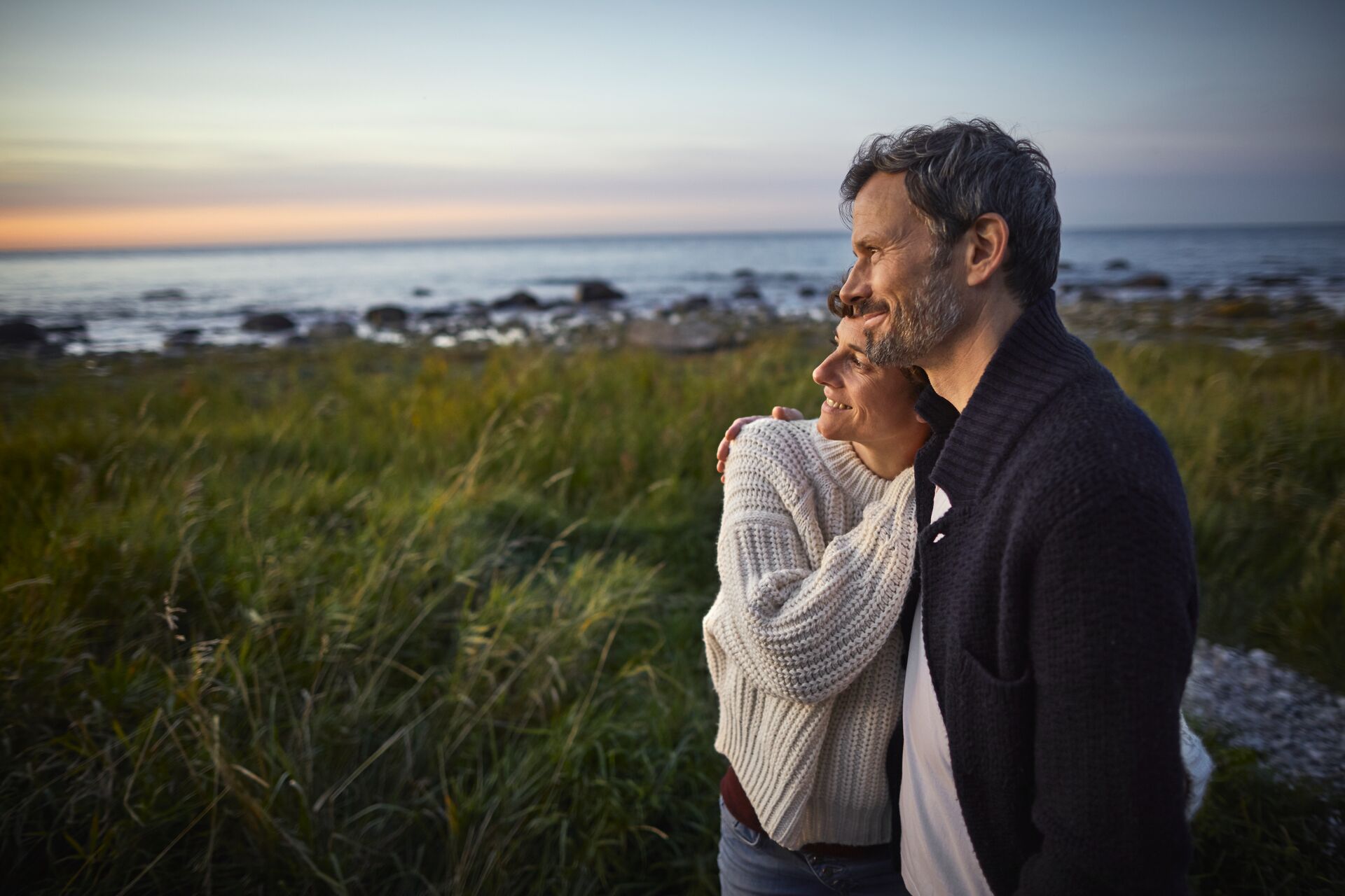 Confident Couple Looking At View At The Sea