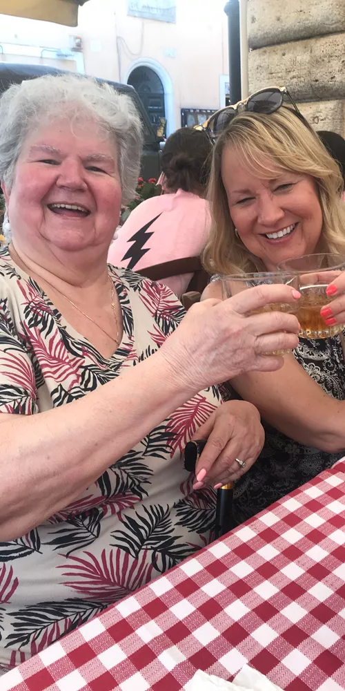 Two women enjoying a drink in Italy