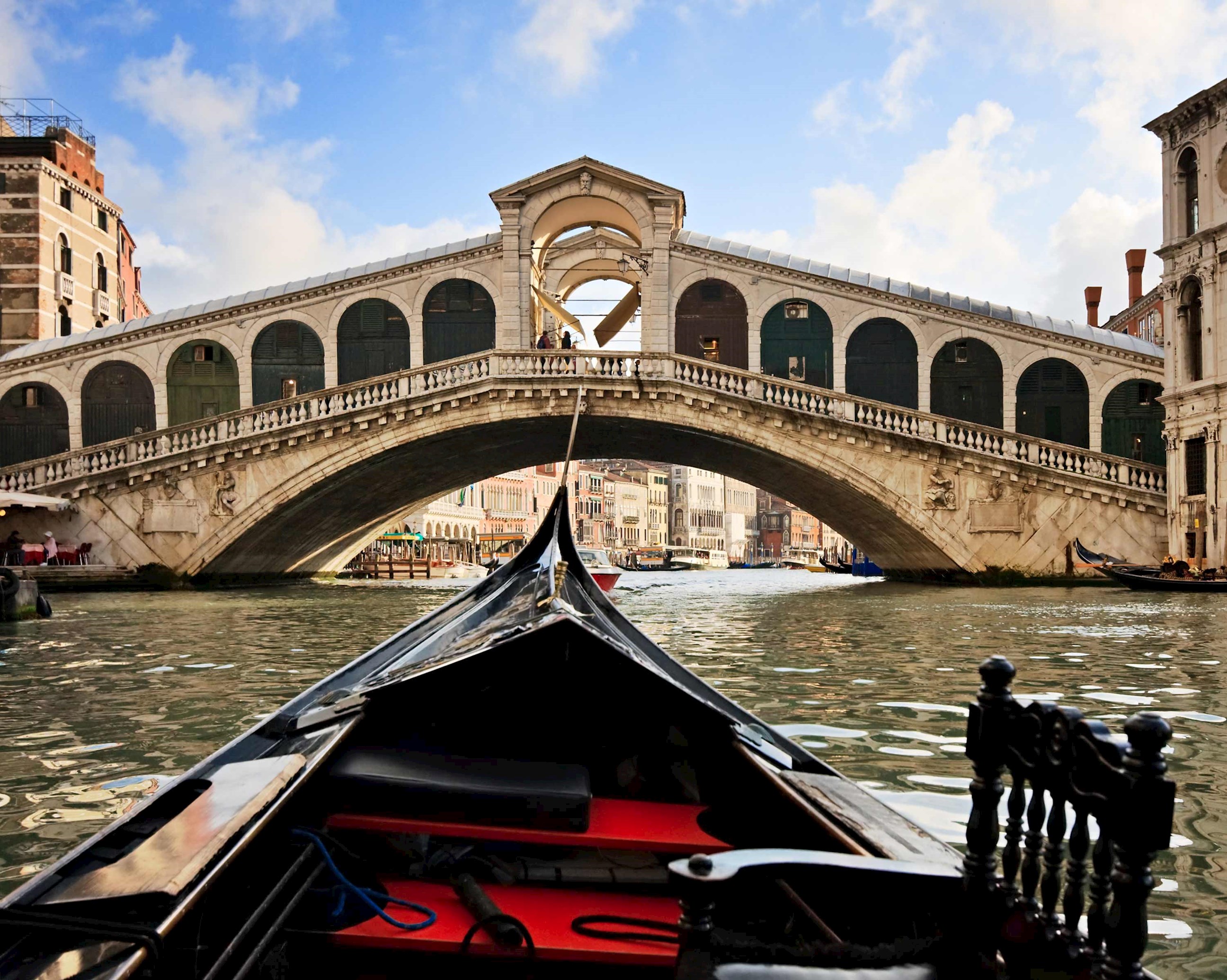 Savour the atmosphere of Venice during a visit to a traditional food market near the Rialto Bridge in Venice, Italy