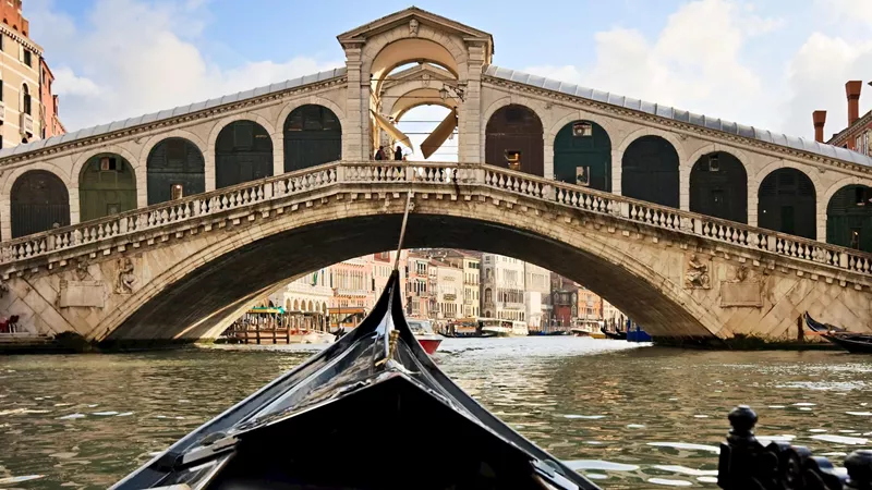 Savour the atmosphere of Venice during a visit to a traditional food market near the Rialto Bridge in Venice, Italy