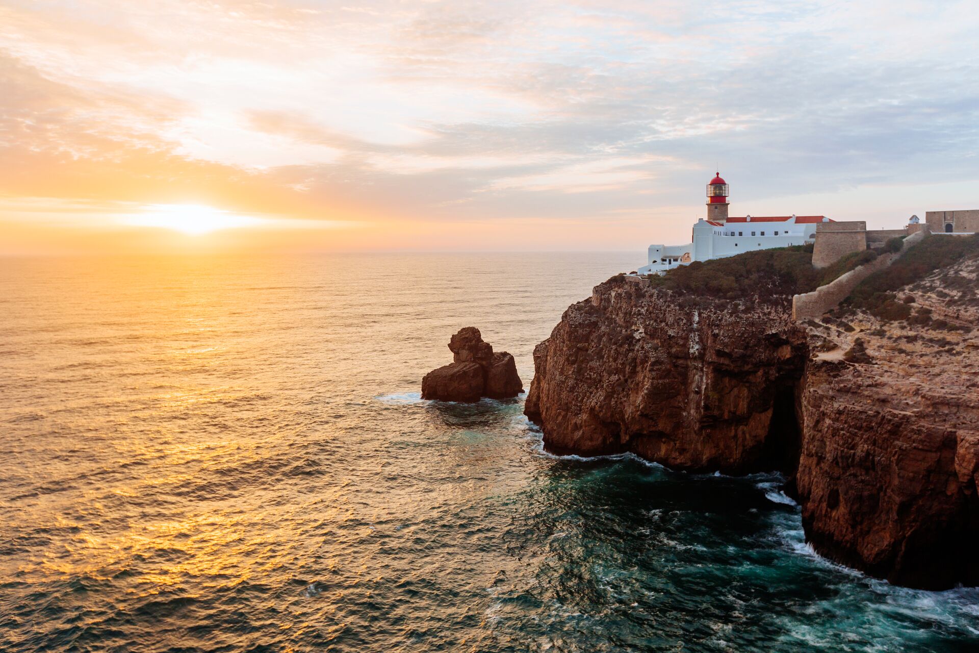 Lighthouse at Cabo De Sao Vincente at sunset in Algarve, Portugal 