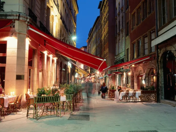 Outdoor Cafes At Night In Lyon France
