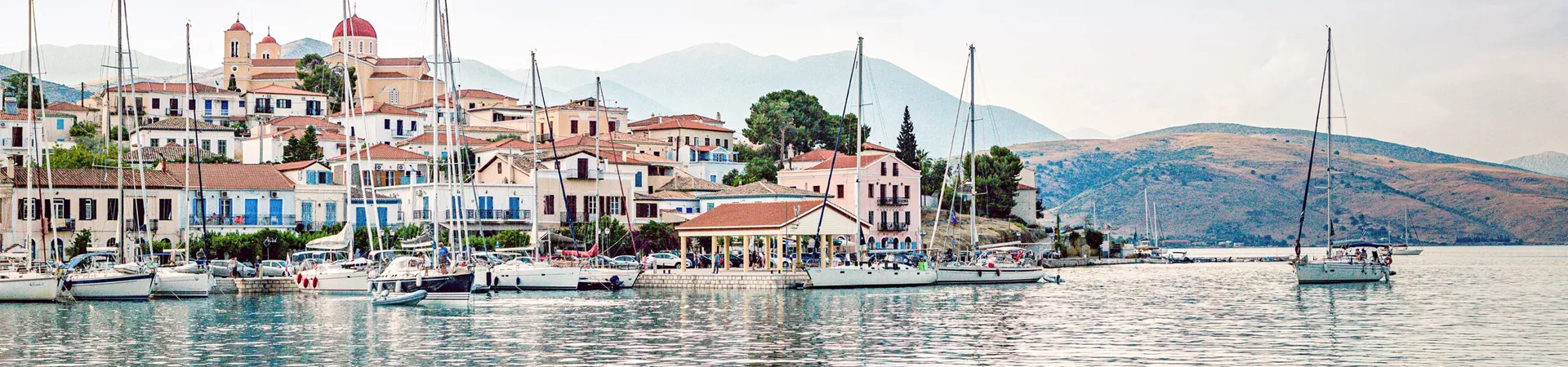 Boat anchored in the Mediterranean Sea, just off the harbour in Galaxidi, Greece